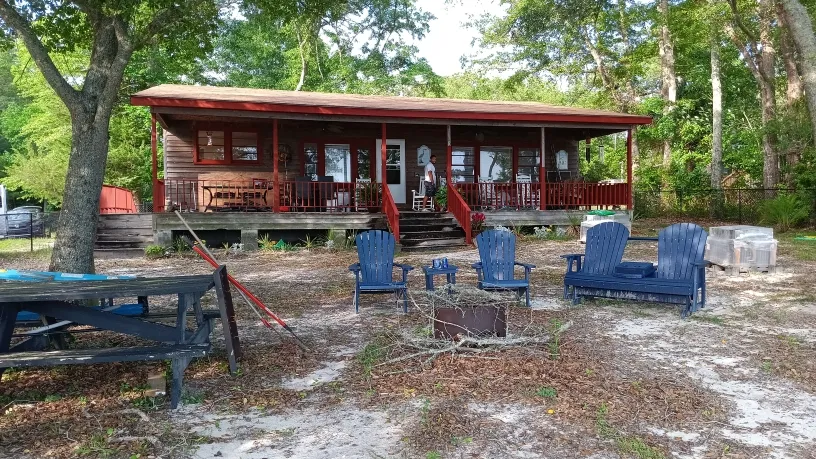 Wrap-around porch painting project in Calabash, NC - exterior trim and railing painting